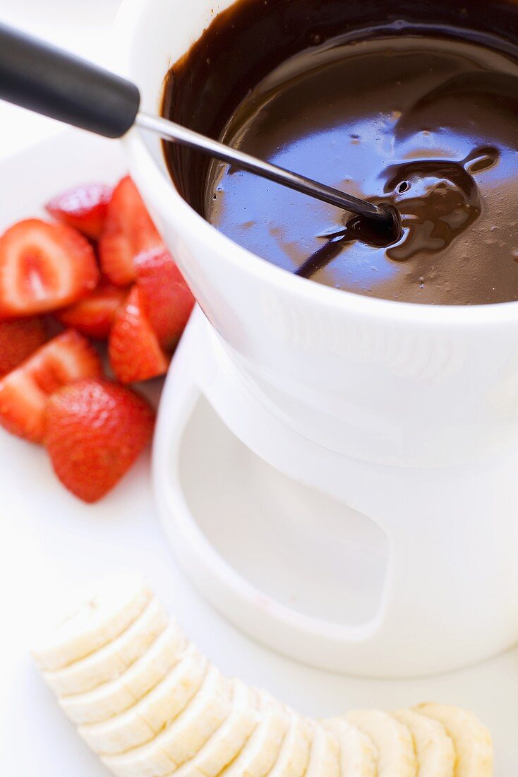 Chocolate fondue with strawberries and bananas