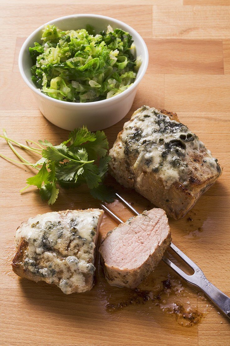 Pork fillet with melted Roquefort and savoy cabbage