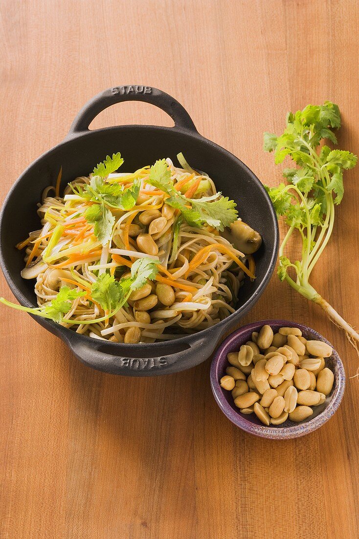 Soya noodles with Asian vegetables, peanuts and coriander