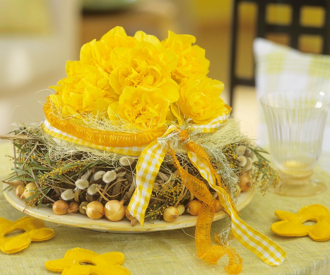 Wreath of willow twigs, catkins, sisal and narcissi