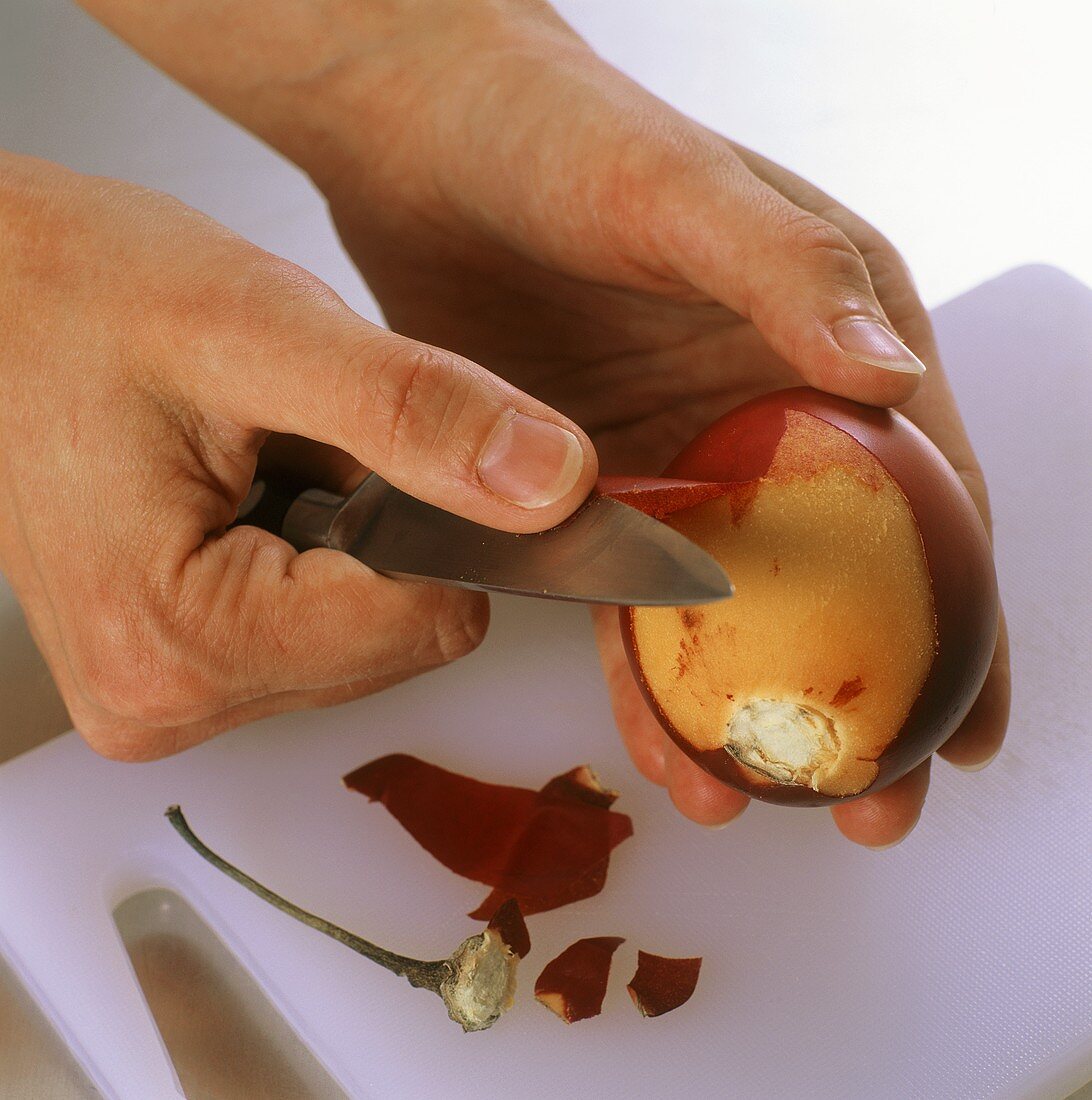 Peeling a tamarillo