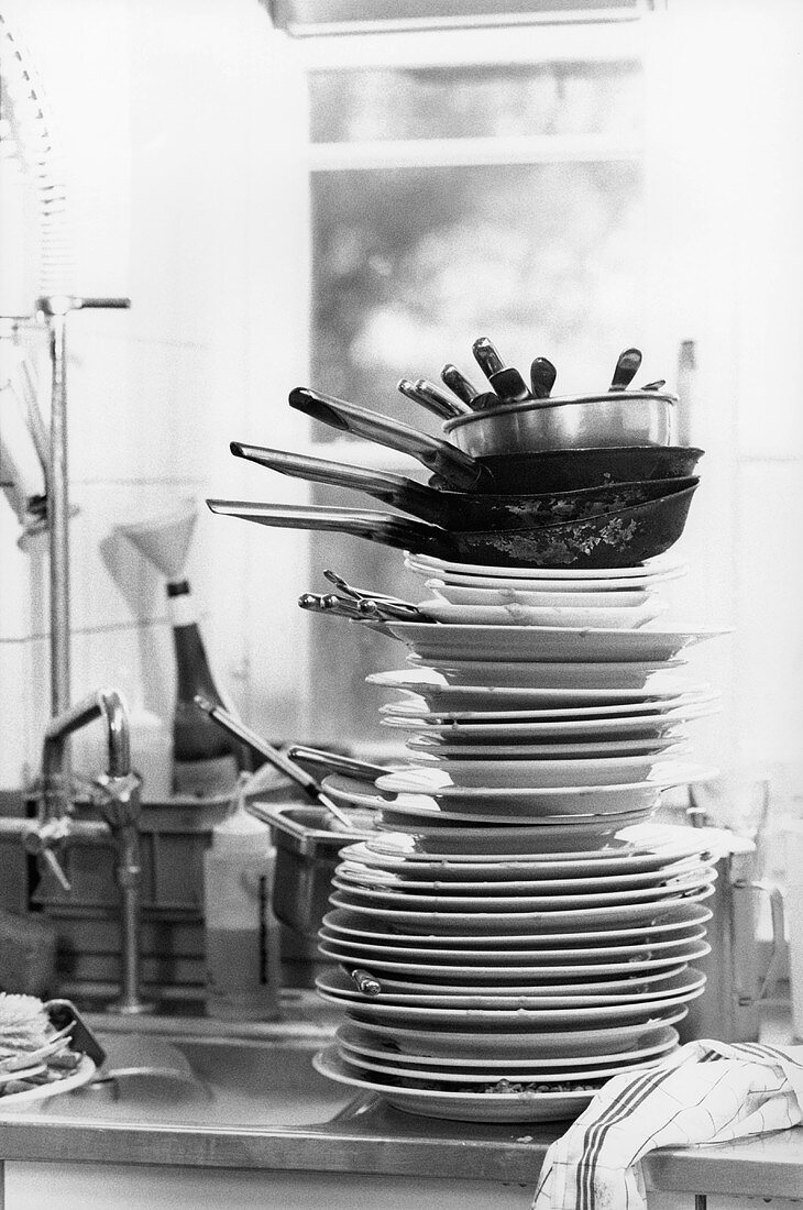 Dirty crockery in a kitchen (black and white photo)