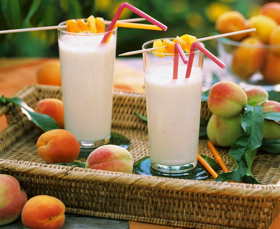 Two milkshakes with apricots and peaches