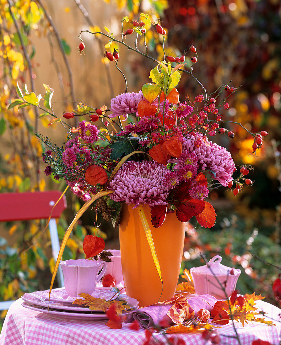 Autumn flower arrangement on table in open air