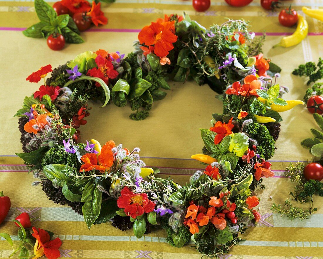 Colourful herb heart with edible flowers