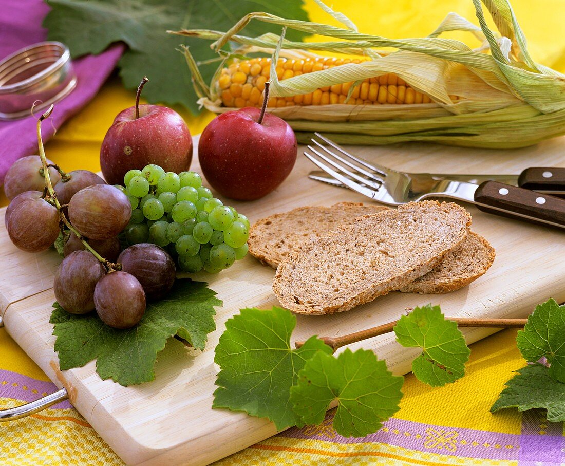 Grapes, apples, sweetcorn and bread