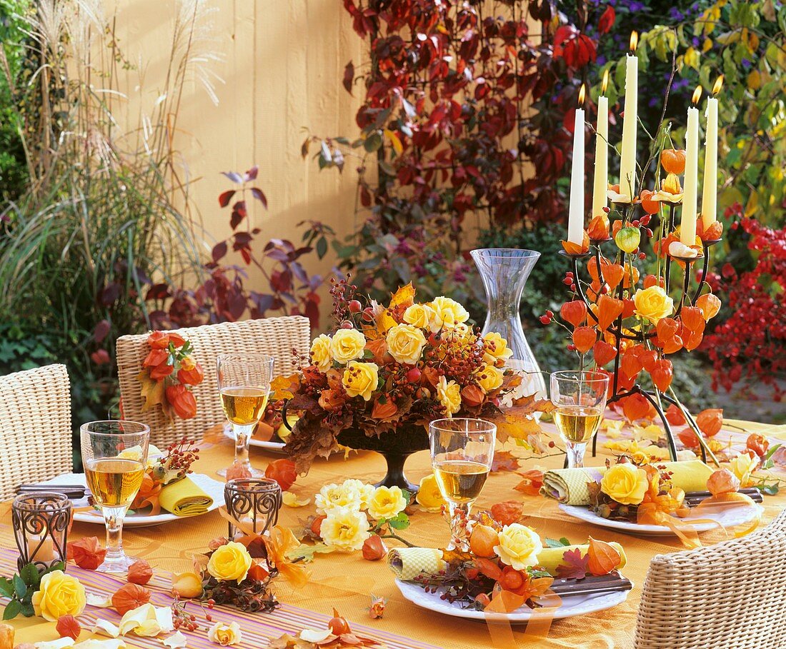 Table decoration of Physalis (Chinese lanterns) & yellow roses