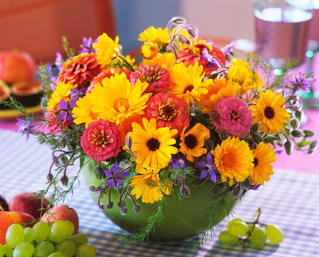 Summer arrangement of marigolds, zinnias and borage