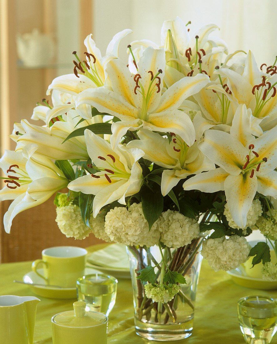 Arrangement of lilies and viburnum