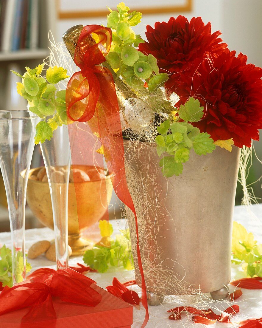 Champagne cooler with champagne bottle, Bells of Ireland & dahlias