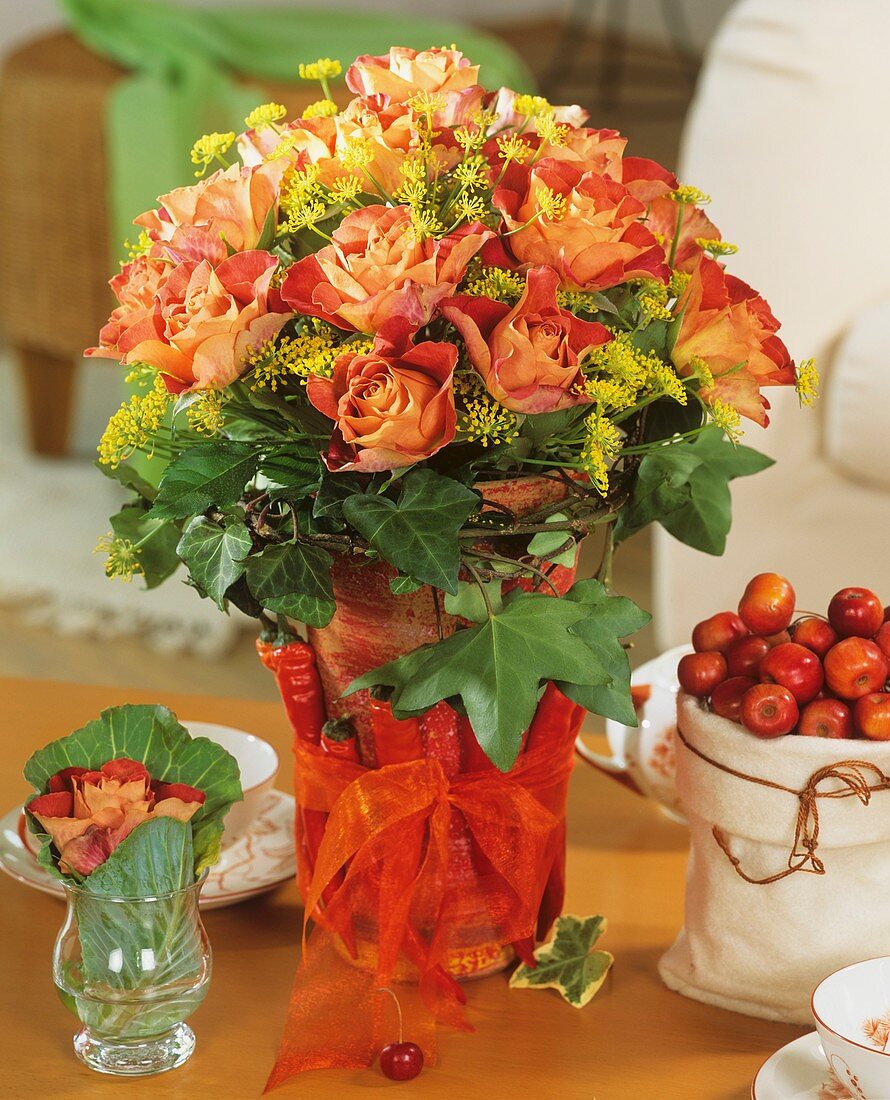 Arrangement of roses, dill & ivy, pot decorated with chillies