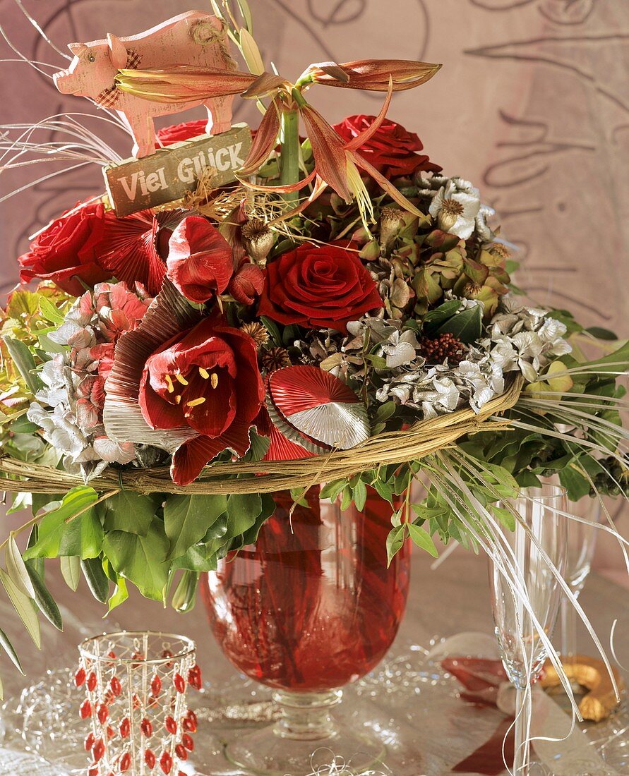New Year arrangement of Amaryllis, hydrangeas & red roses