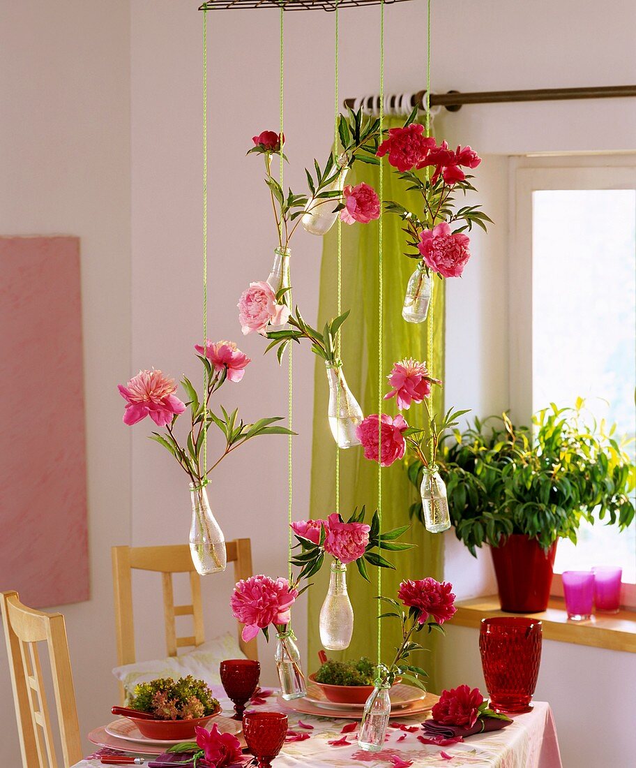Hanging decoration: peonies and willow myrtle in small bottles