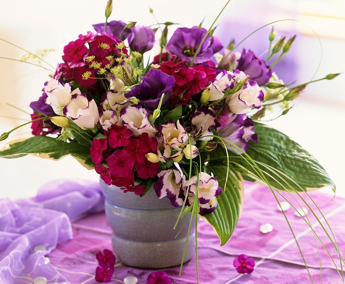 Arrangement of Lisianthus, Phlox, Hosta and bear grass