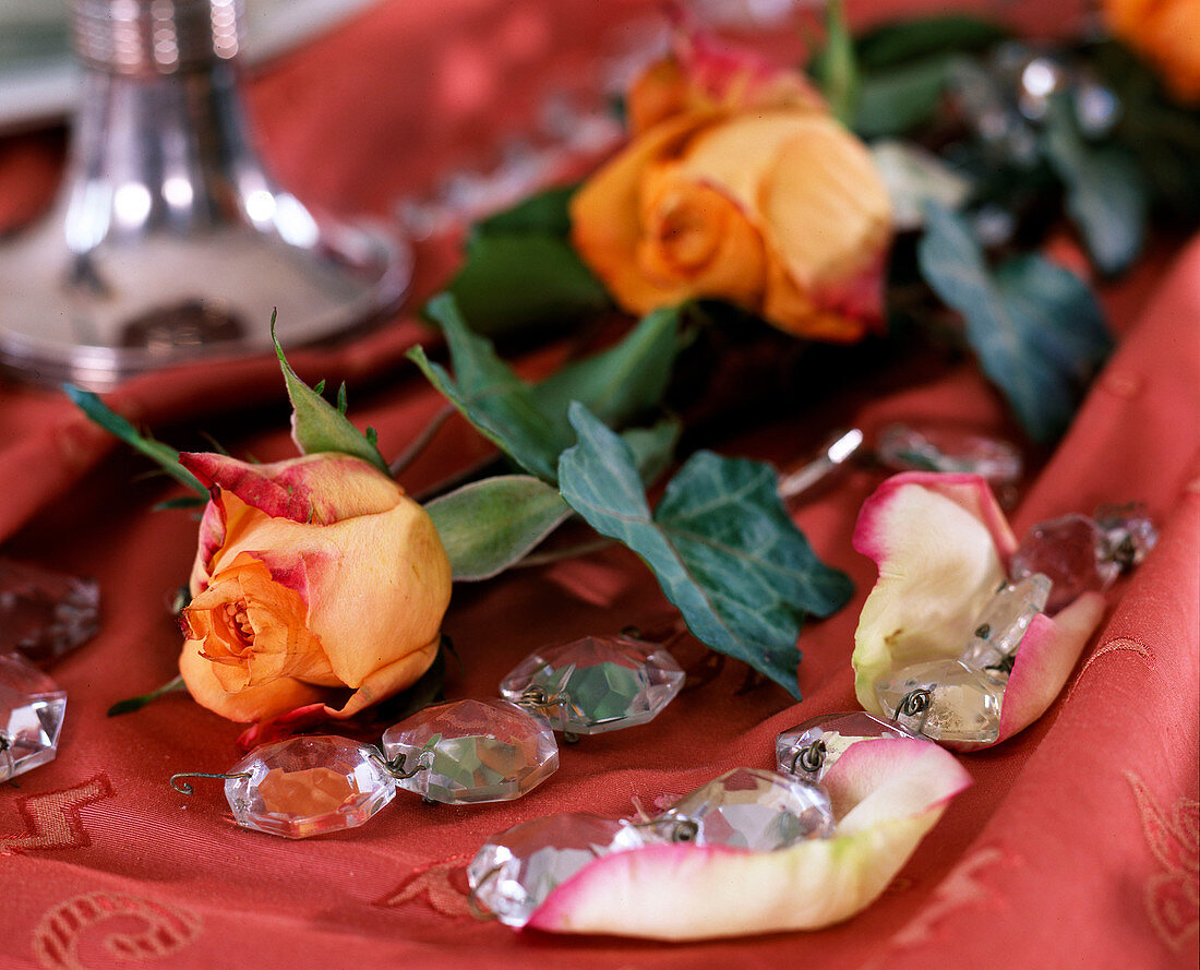 Orange roses with ivy and glass crystal