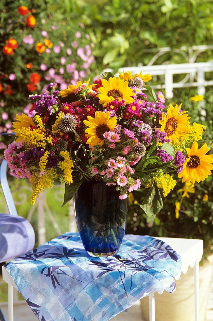 Autumn arrangement: sunflowers, Michaelmas daisies & golden rod