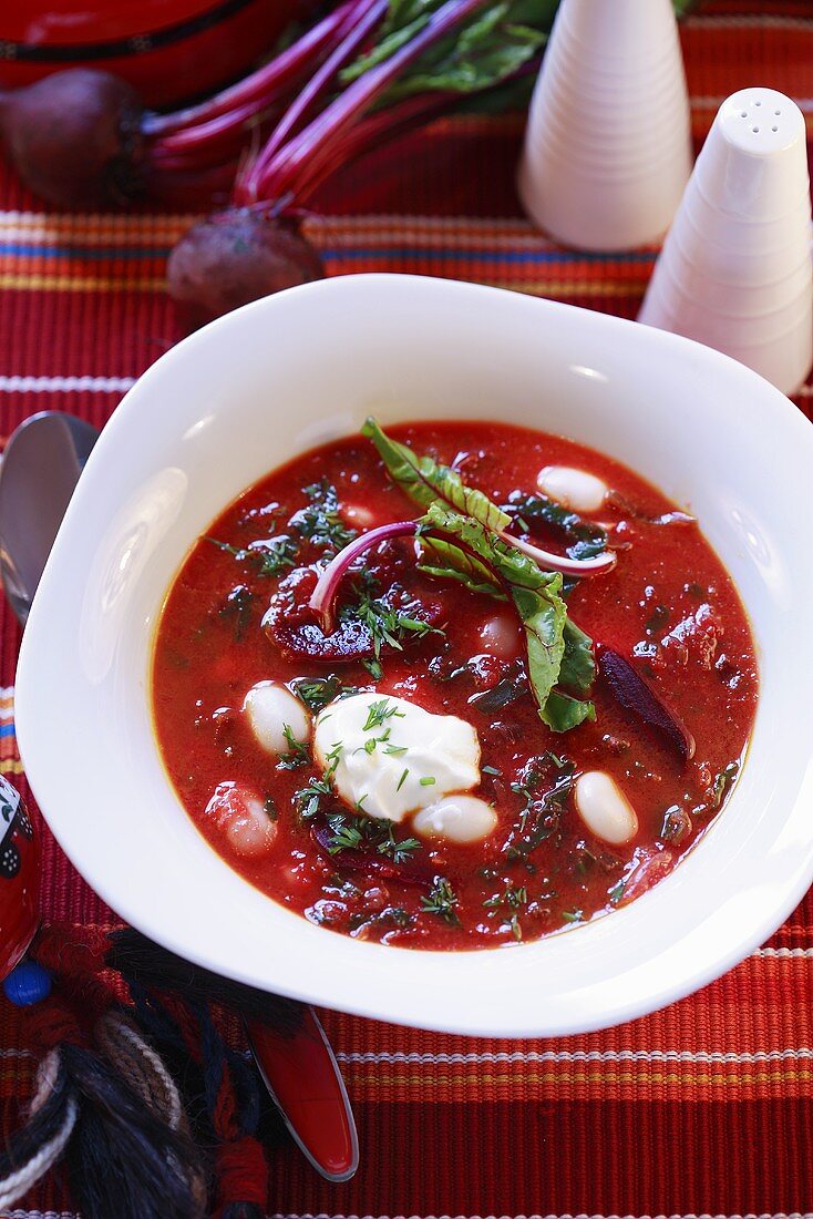 Beetroot soup with beans and sour cream