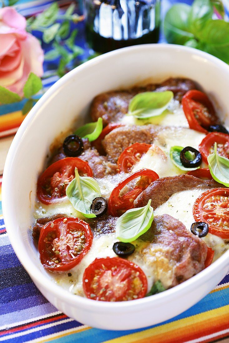 Pork with mozzarella, tomatoes and basil