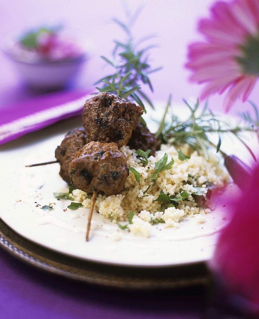 Mince skewered on rosemary with couscous