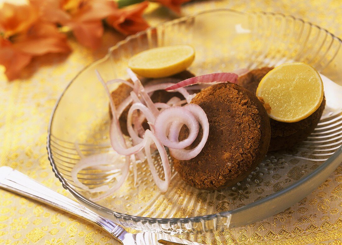 Shami kabab (Indian burgers) with onion rings