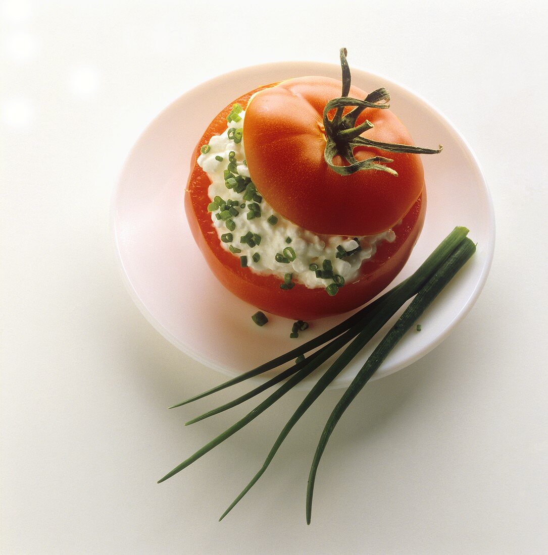 Tomato stuffed with soft cheese