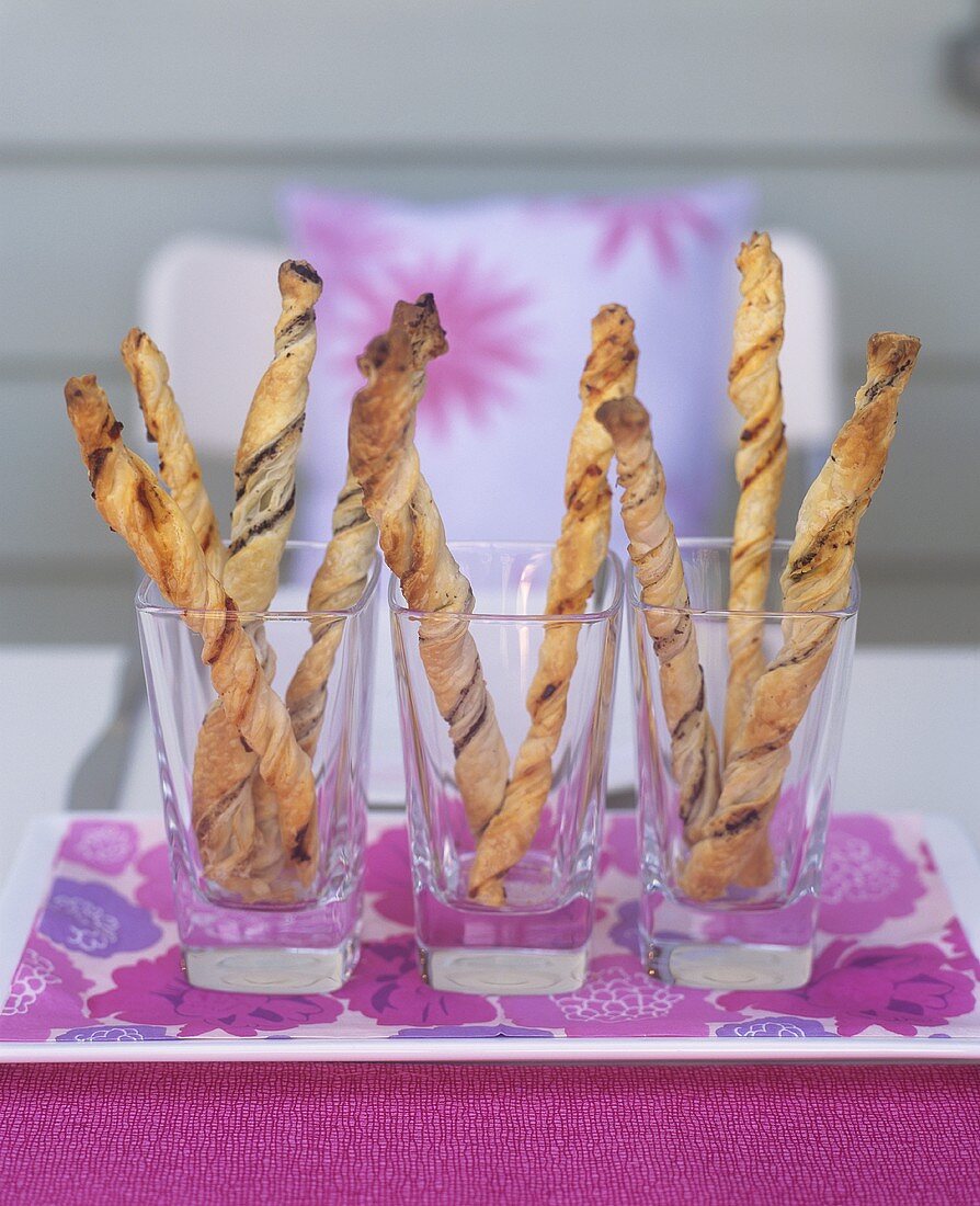 Cheese straws in glasses