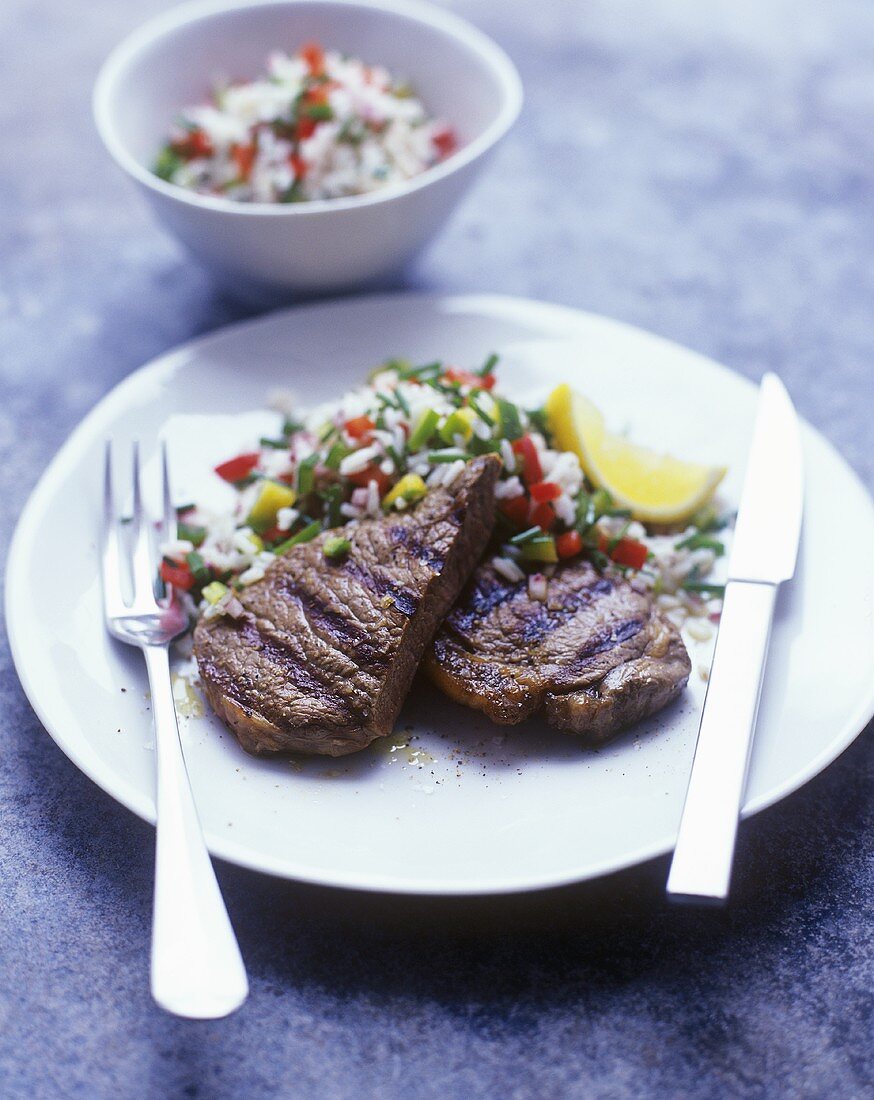 Grilled steaks with rice salad