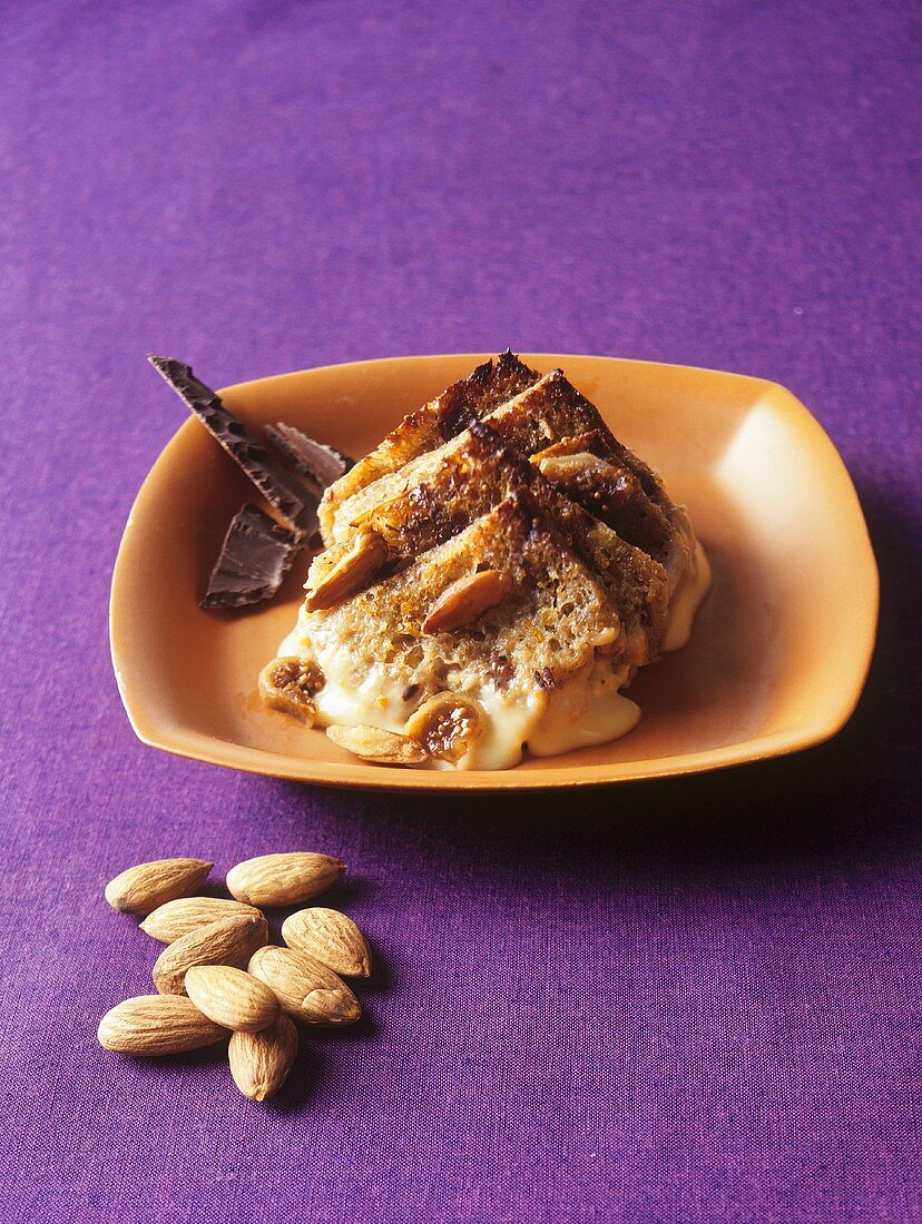 Bread and butter pudding with dried figs and almonds