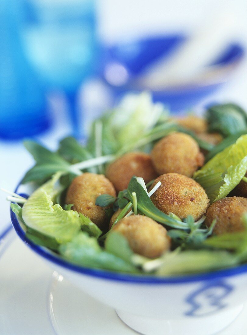 Deep-fried fish balls with salad
