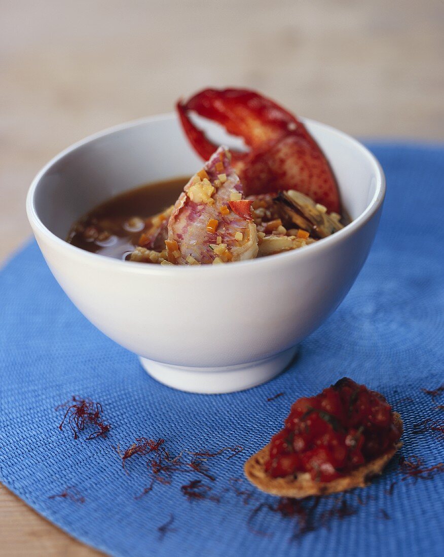 Fish and seafood stew with tomato crostini