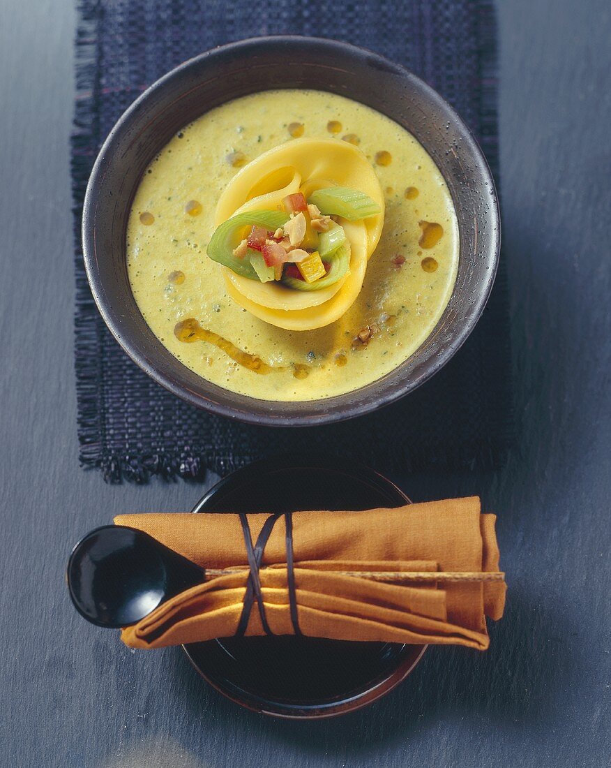 Coconut soup with vegetables and mango