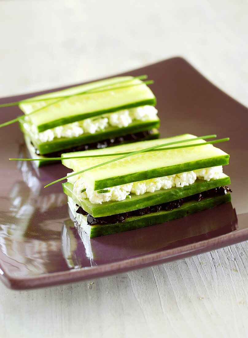 Cucumber layered with soft cheese