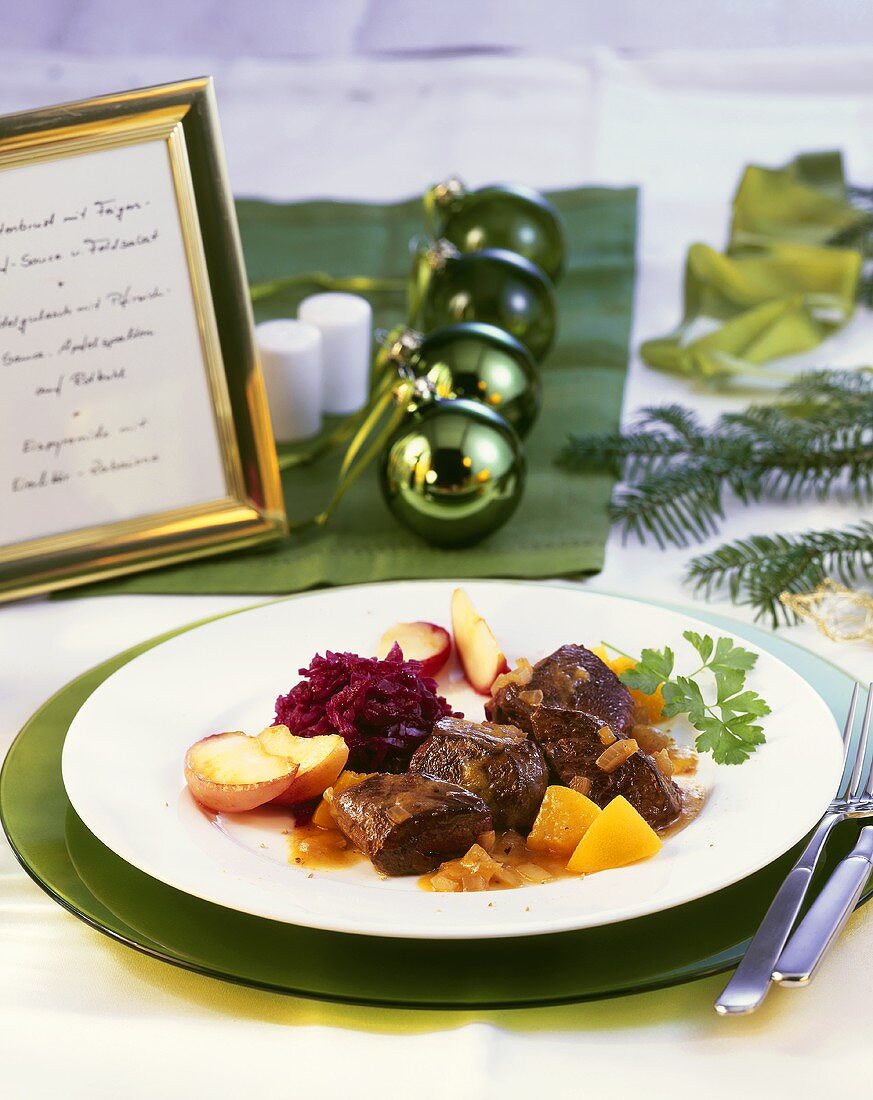 Venison goulash with peach sauce and caramelised apples