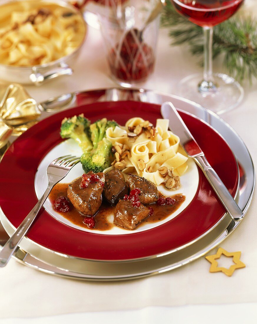 Venison goulash in cranberry sauce with ribbon pasta & broccoli