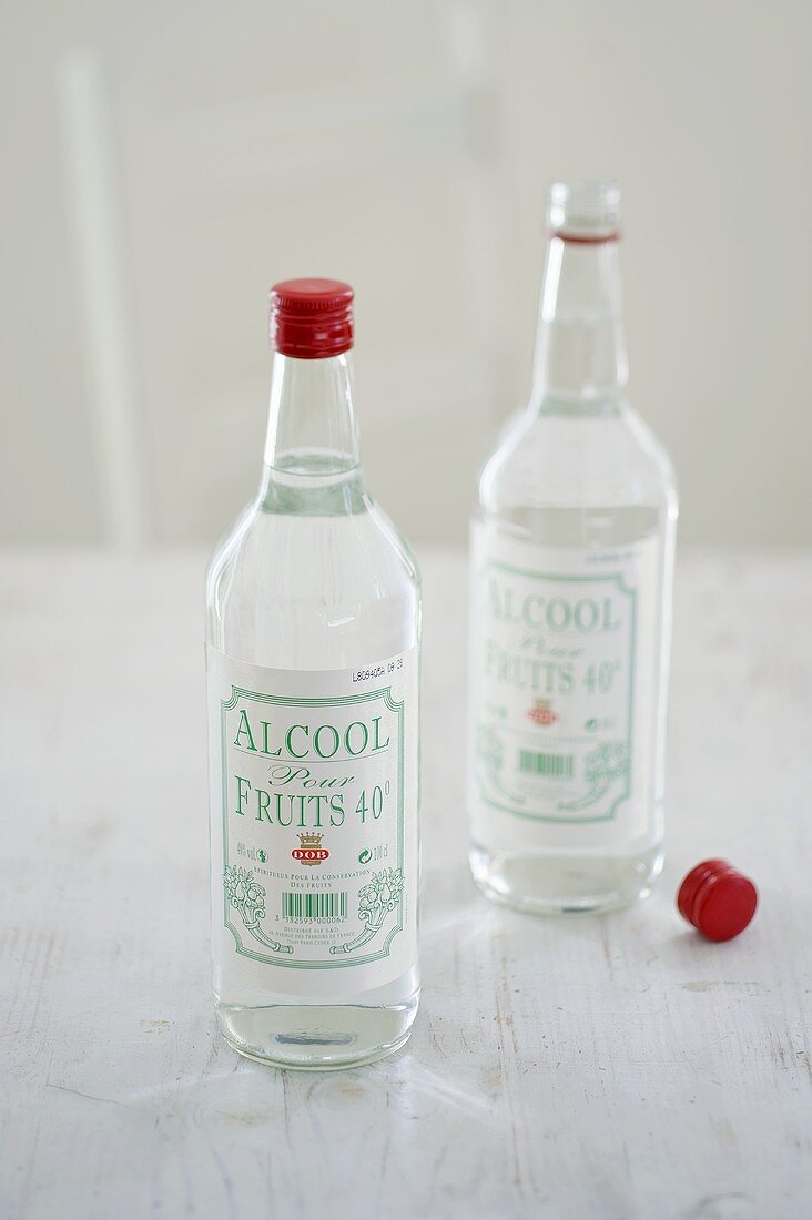 Two bottles of alcohol for preserving fruit