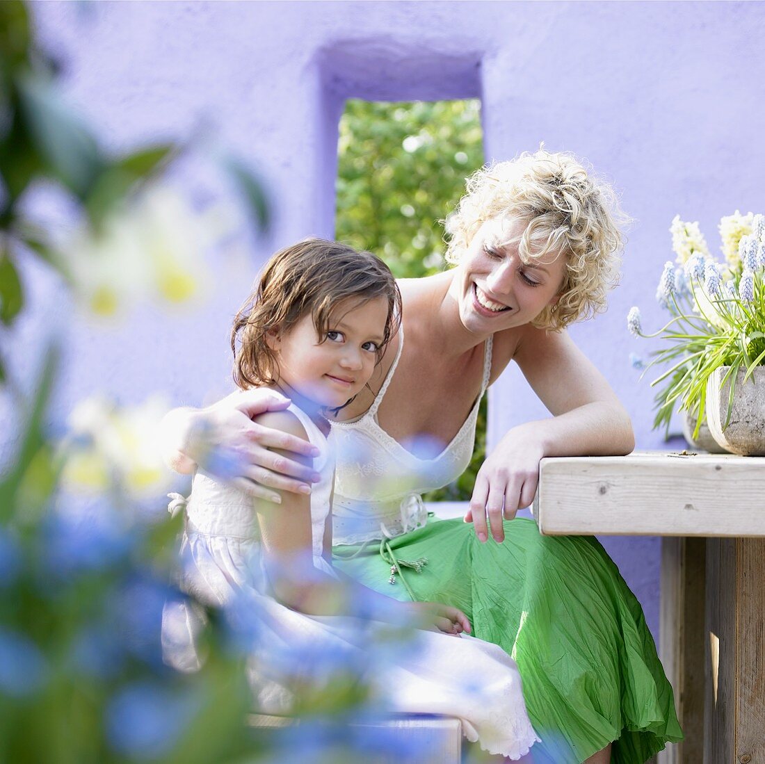 Woman and child at garden table