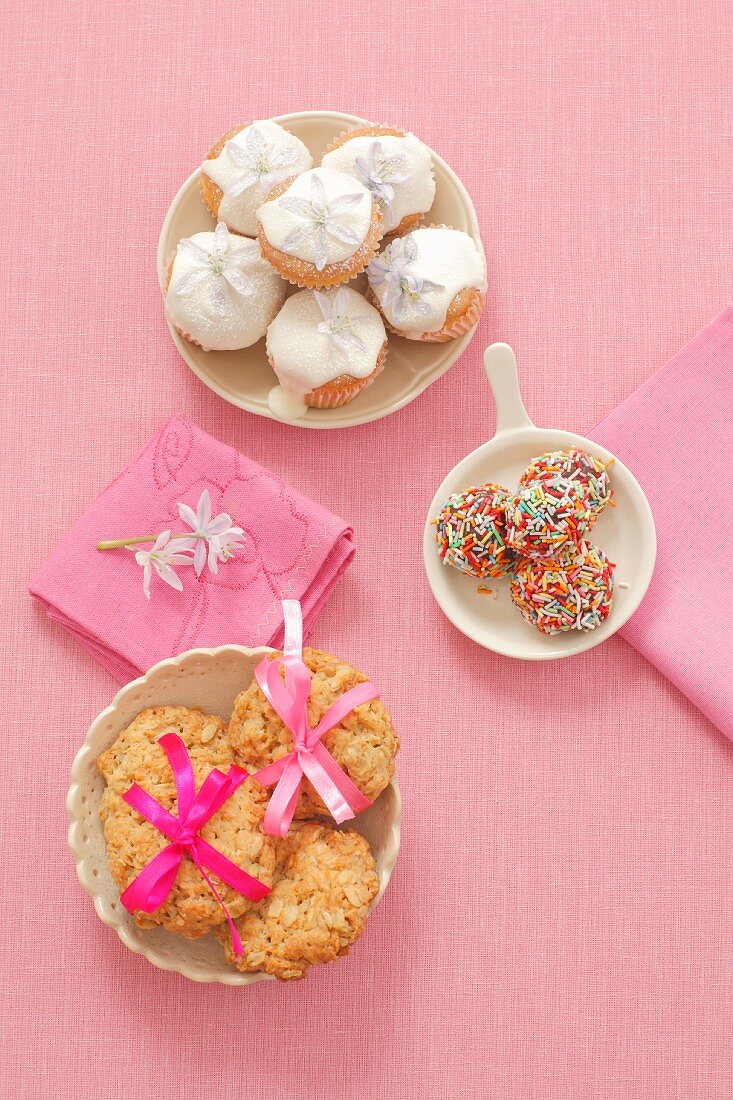 Oat biscuits, chocolate truffles with sprinkles, mini-cupcakes