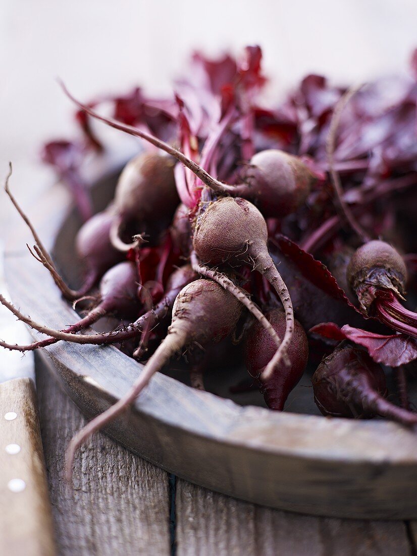 Baby beetroots in a wooden bowl