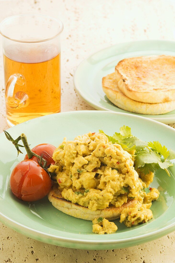 Scrambled egg with Indian spices on toasted muffin