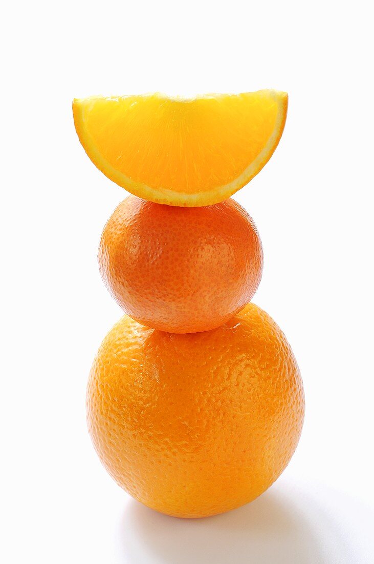 Orange, clementine and orange wedge, stacked