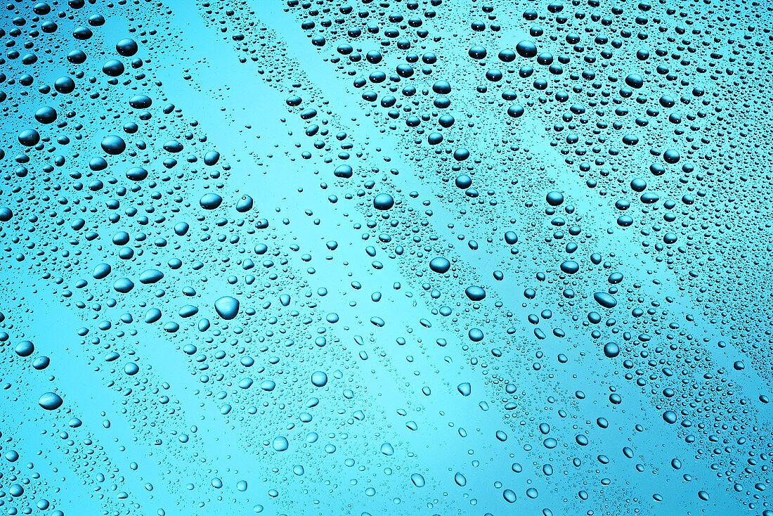 Drops of water on blue surface