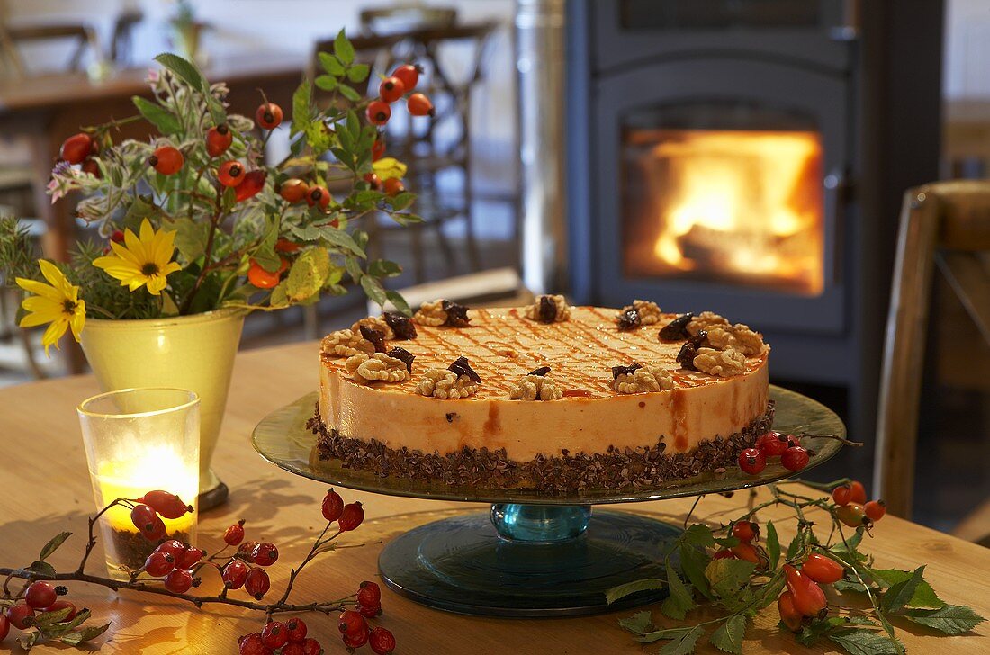 Rose hip cake on table in front of fire