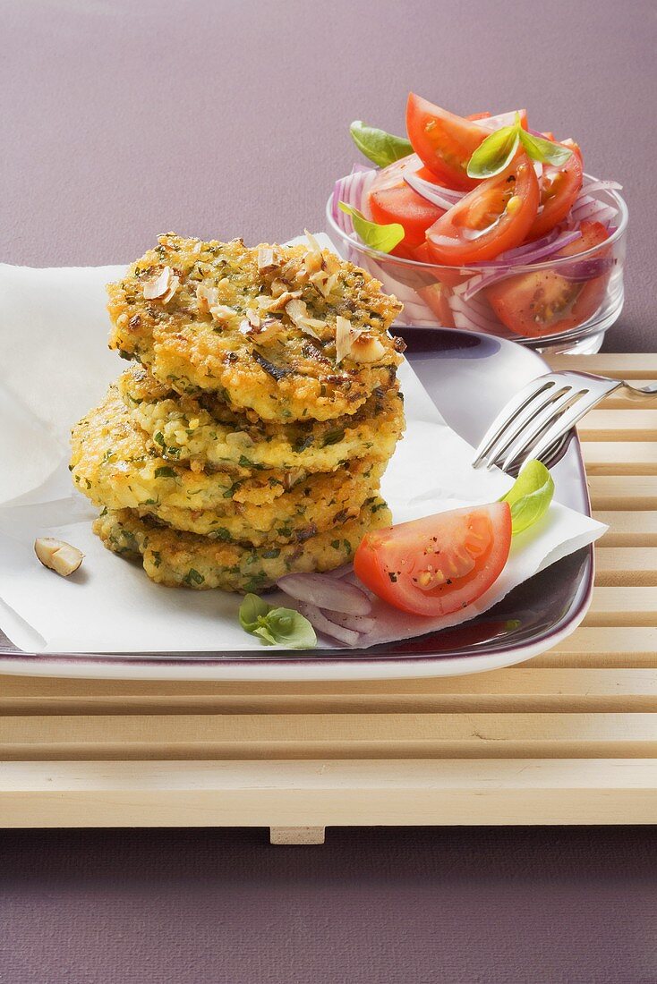 Millet cakes with tomato salad