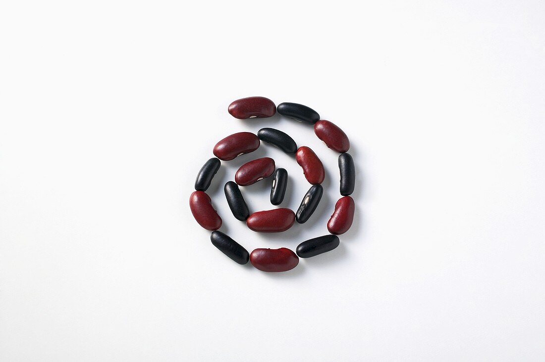 Red and black beans arranged in a spiral