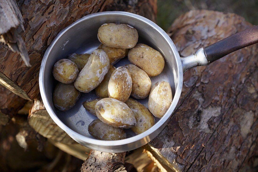 Potatoes cooked in their skins in a pan