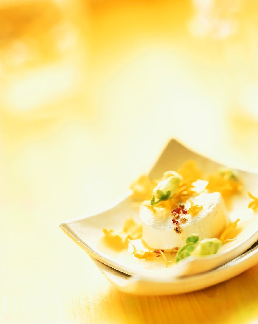 Fresh goat's cheese with flower salad