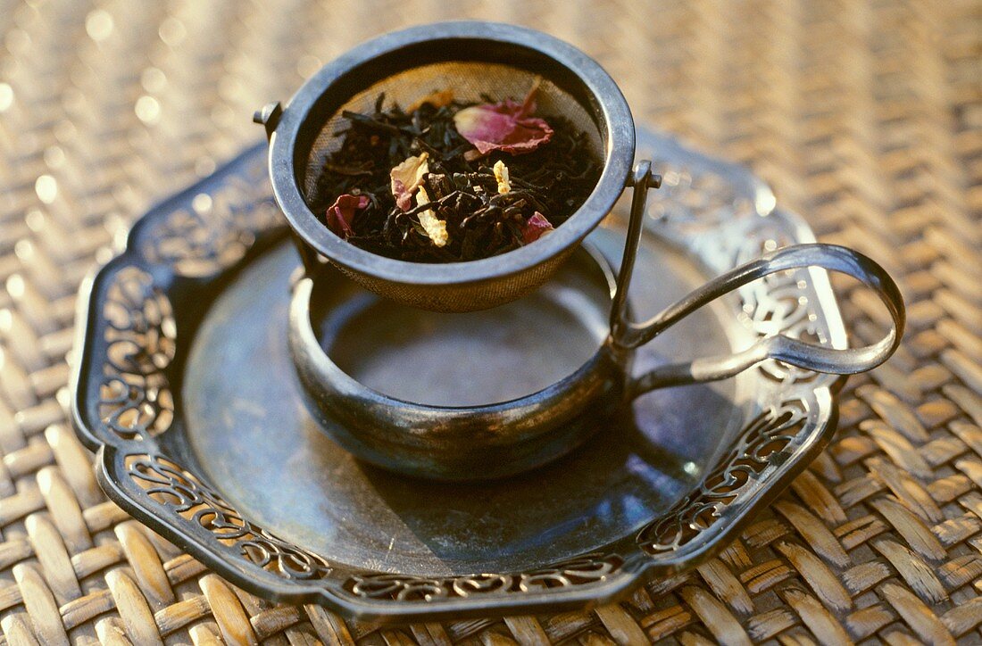 Dried tea leaves in tea strainer