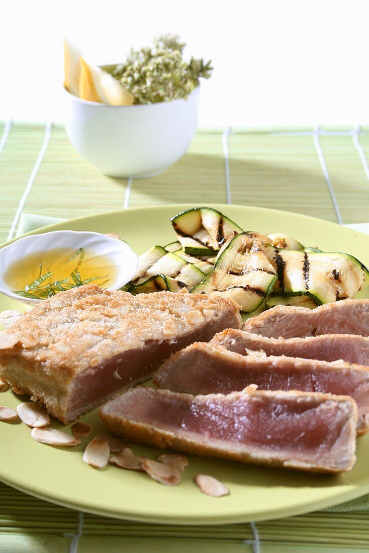 Seared tuna steak with flaked almonds and courgettes