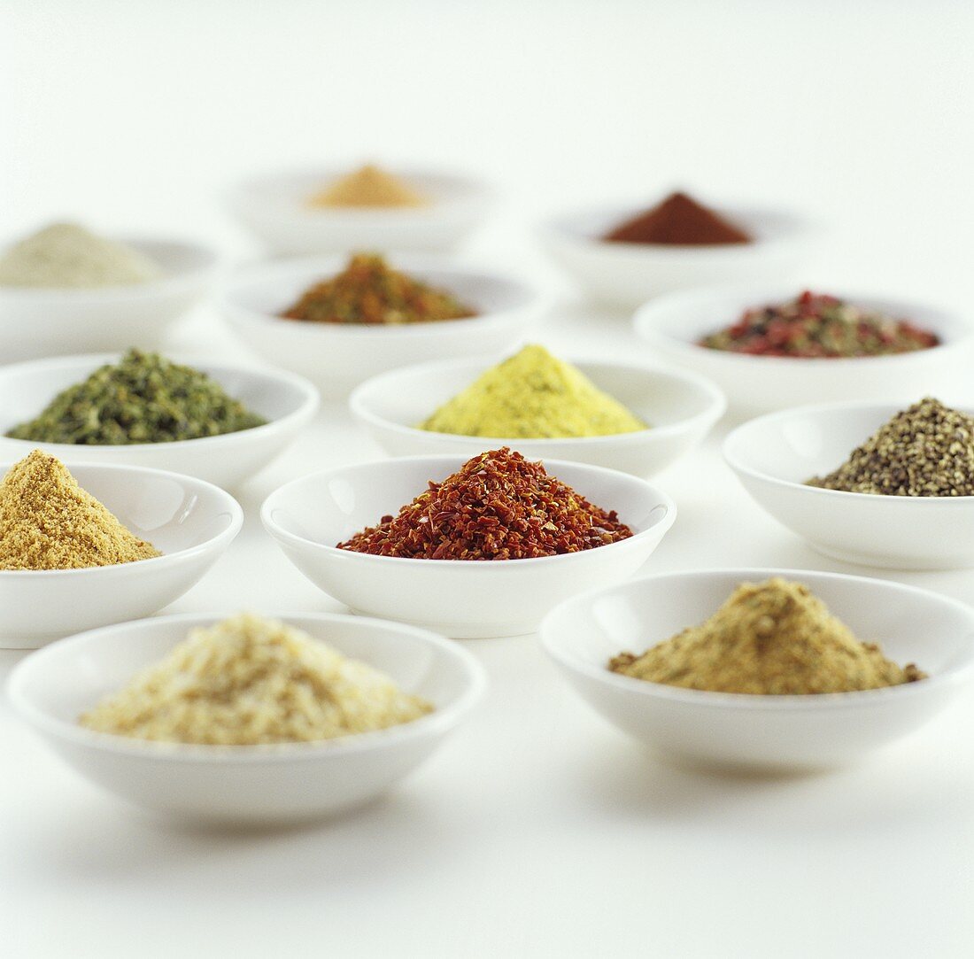 Spices, spice mixtures and marinades in small bowls