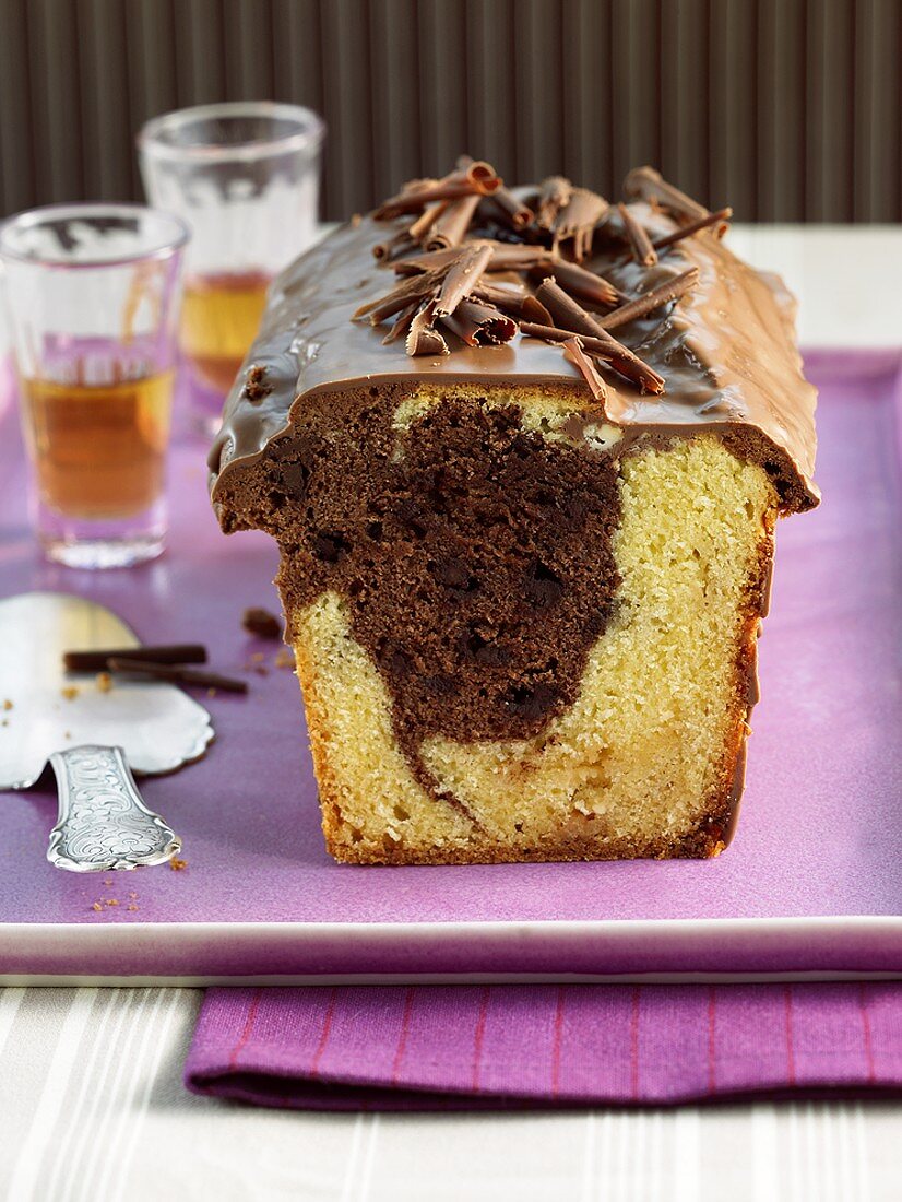 Marble cake with chocolate icing and chocolate curls